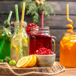 side-view-organic-fresh-juices-bottles-served-with-tubes-fruits-wooden-cutting-board.jpg