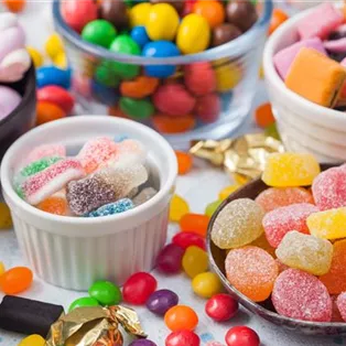 jelly-sugar-gums-candies-blue-table-with-liquorice-allsorts-strawberry-marshmallow-large-variety-sweets-candies.jpg